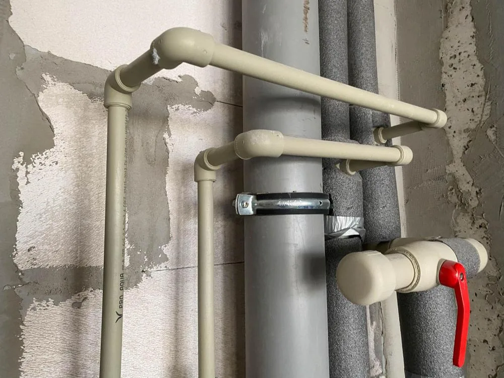 Foam pipe insulation wrapped around exposed plumbing for cold-weather protection