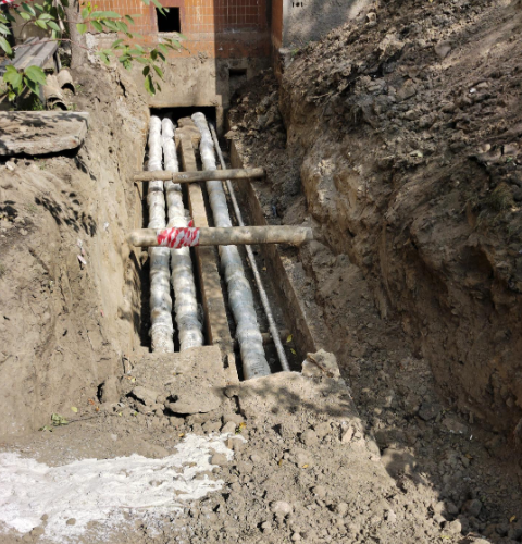 Excavated sewer line section in a Philadelphia row home yard during inspection